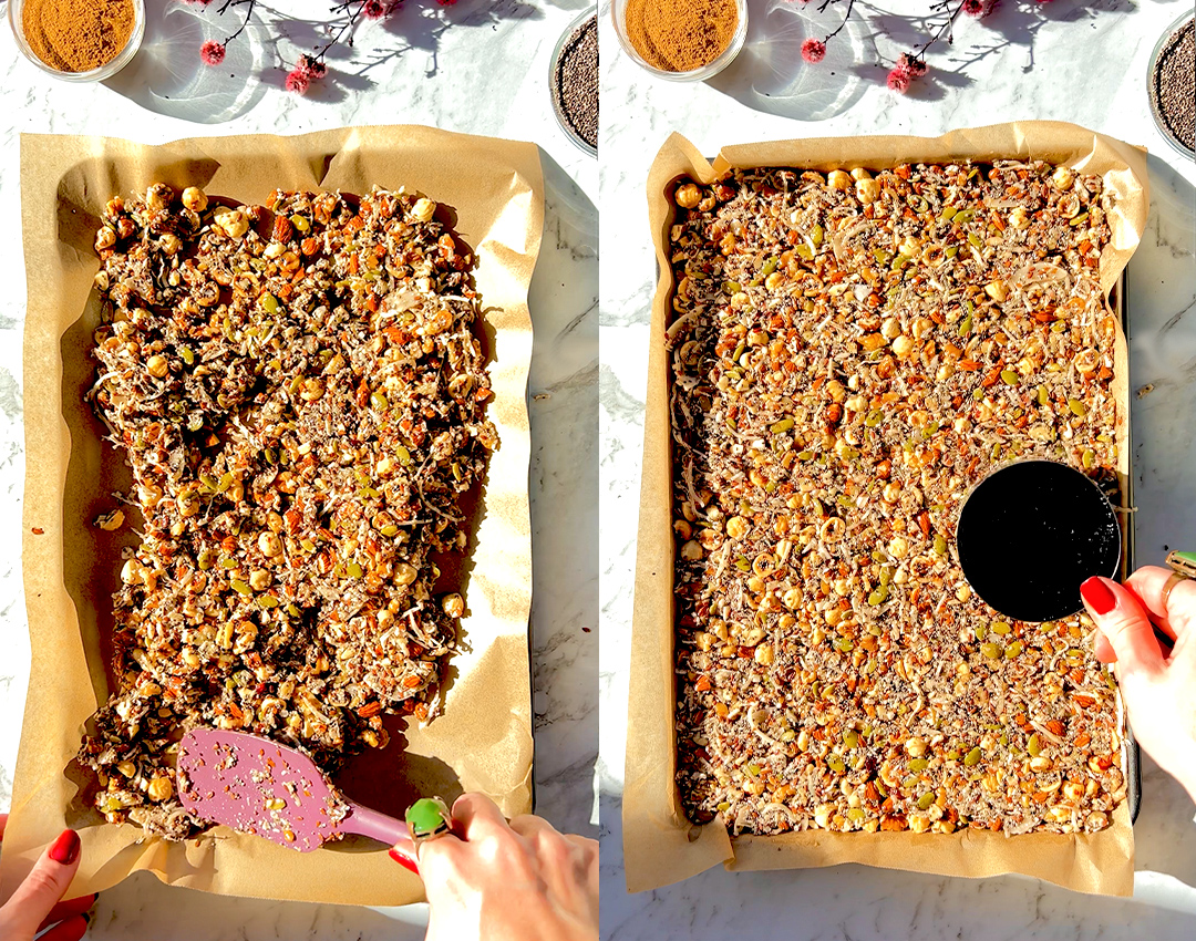 Granola mixture pressed onto a parchment-lined baking sheet and ready to bake. Paleo-friendly and naturally sweetened with honey or sugar-free maple syrup.
