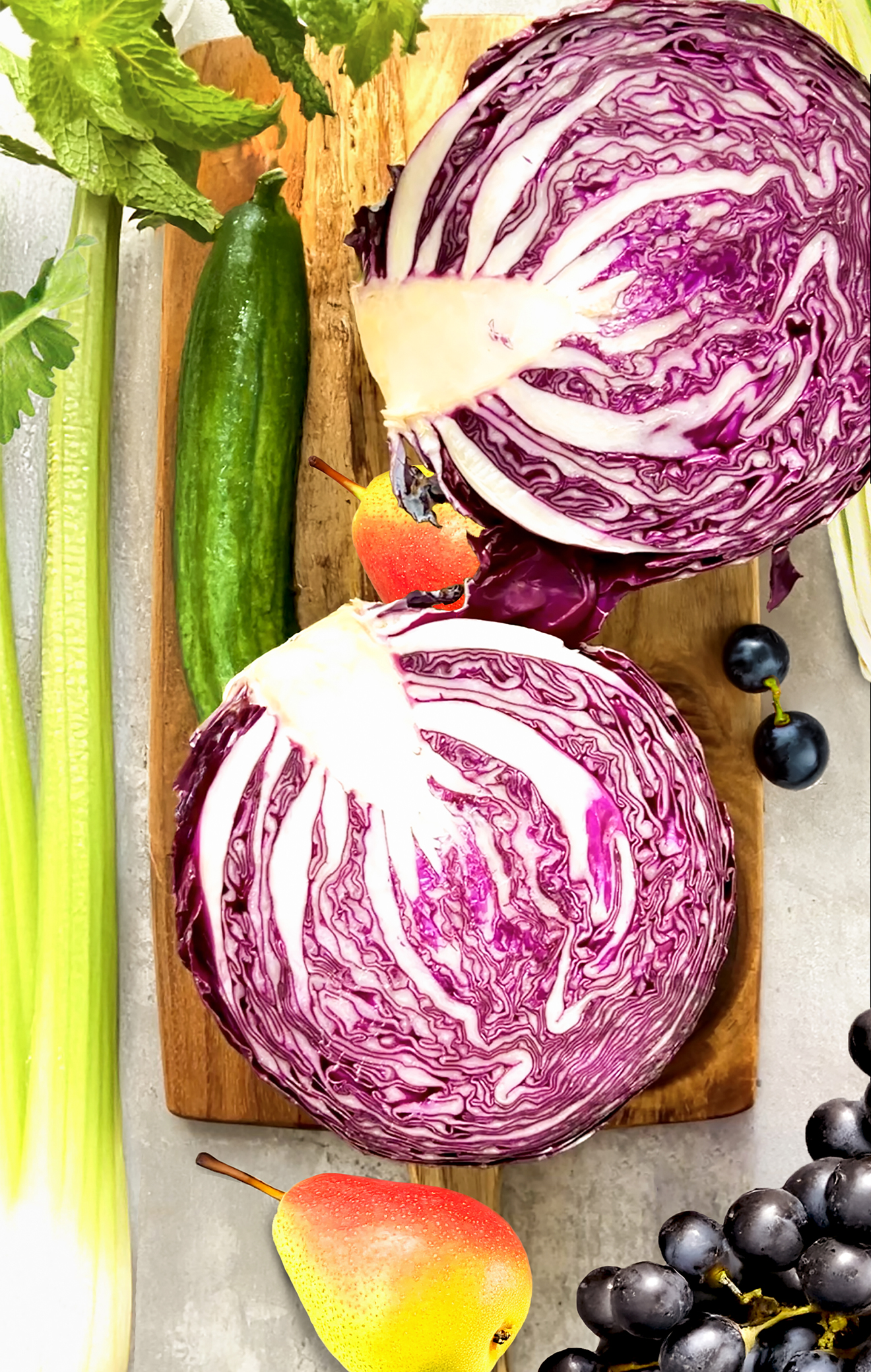 Fresh ingredients for anti-inflammatory juice – red cabbage, cucumber, pear, black grapes, and mint packed with antioxidants and fiber for detox and weight loss