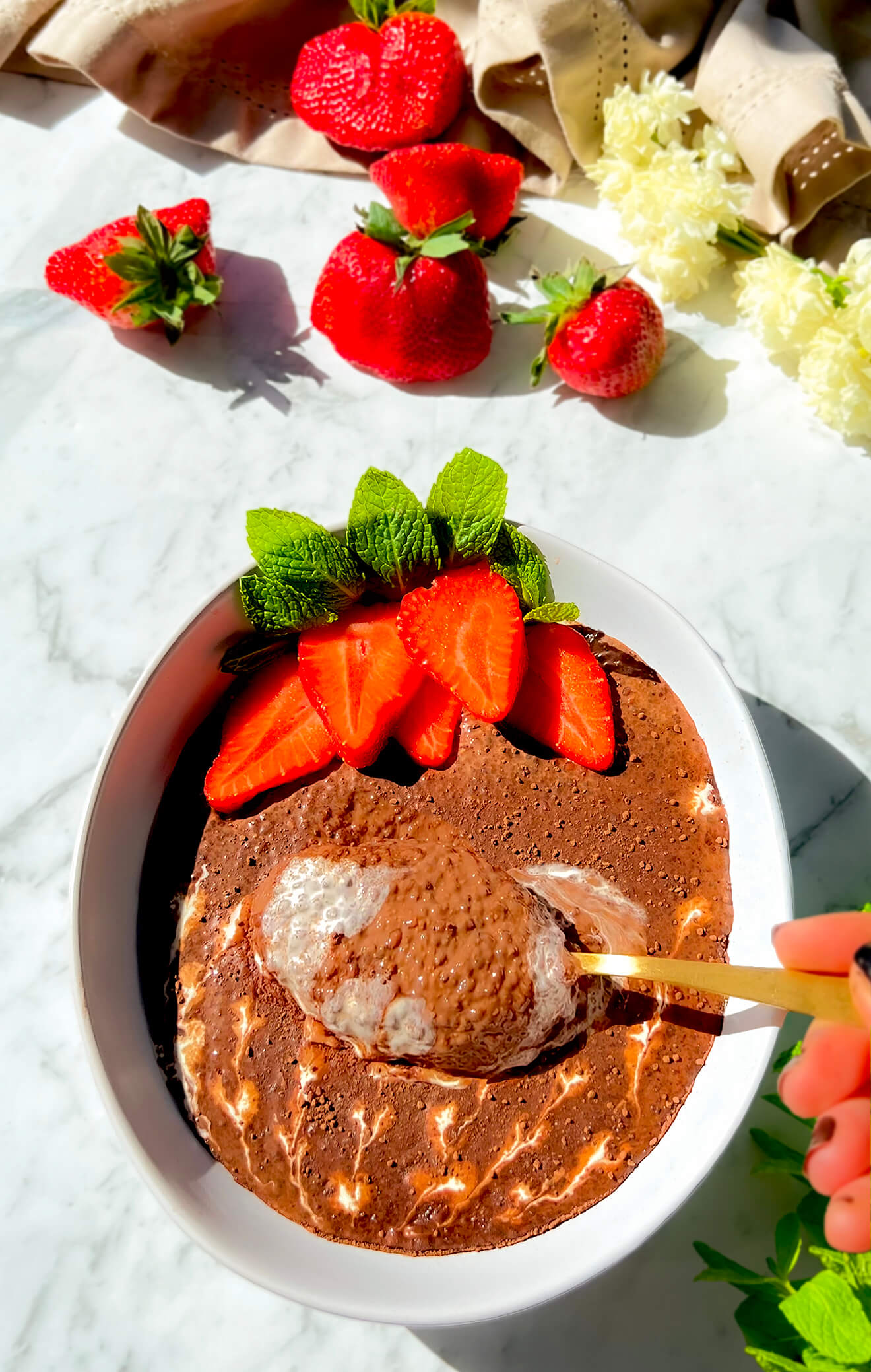 zoomed in shot, with spoon dipped in to show the thick and ultra creamy texture of the Chocolate Chia & Flaxseed Pudding- A Quick & Easy 6 ingredients recipe- Healthy, Low-Carb, Paleo, Gluten-Free, Dairy-Free, Sugar- Free