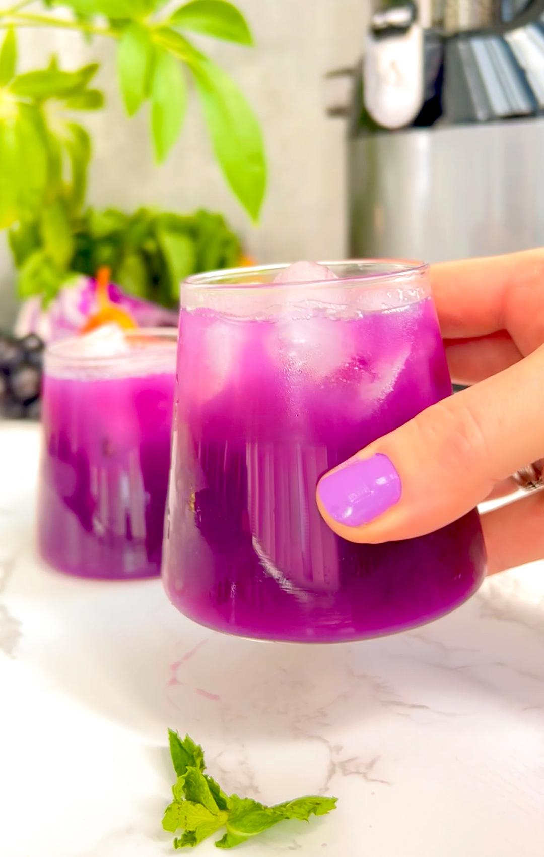 Detox juice made with red cabbage, cucumber, black grapes, mint, and pear – supports weight loss, hydration, gut health, and inflammation reduction