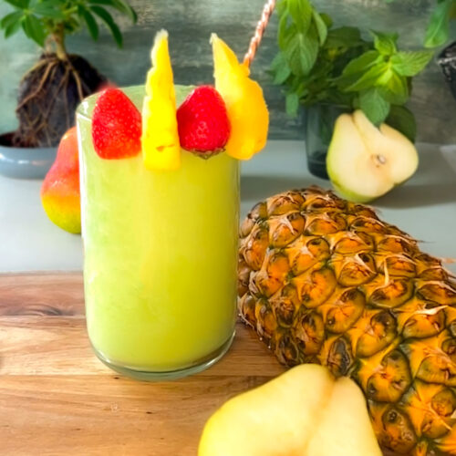 Tropical Immune-Boosting Smoothie combination of pineapple, pear, strawberry, spinach, and mint. these ingredients Increases Metabolism and Supports Weight Loss