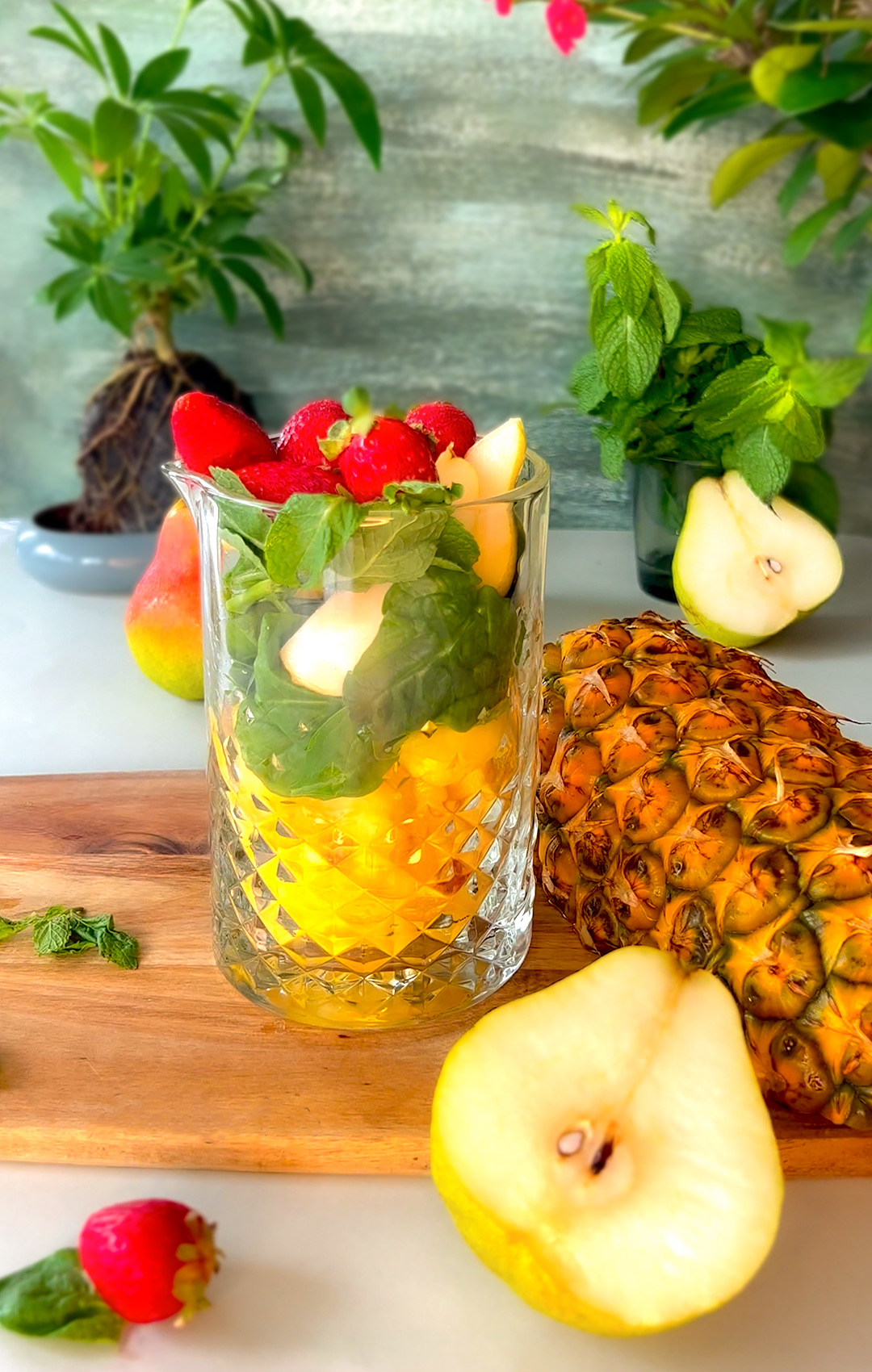 delightful and delicious Refreshing Tropical Immune-Boosting Smoothie, mad of fresh pineapple, pear, strawberry, spinach, and mint- perfect for summer