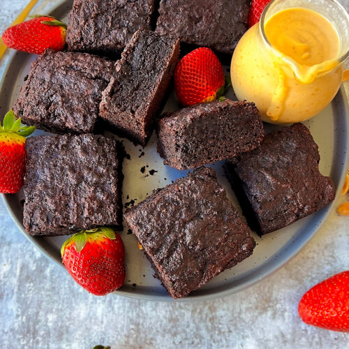 Healthy, gluten-free banana date brownie cake slices on a plate with peanut butter sauce, naturally sweetened and Pale & Gluten-free