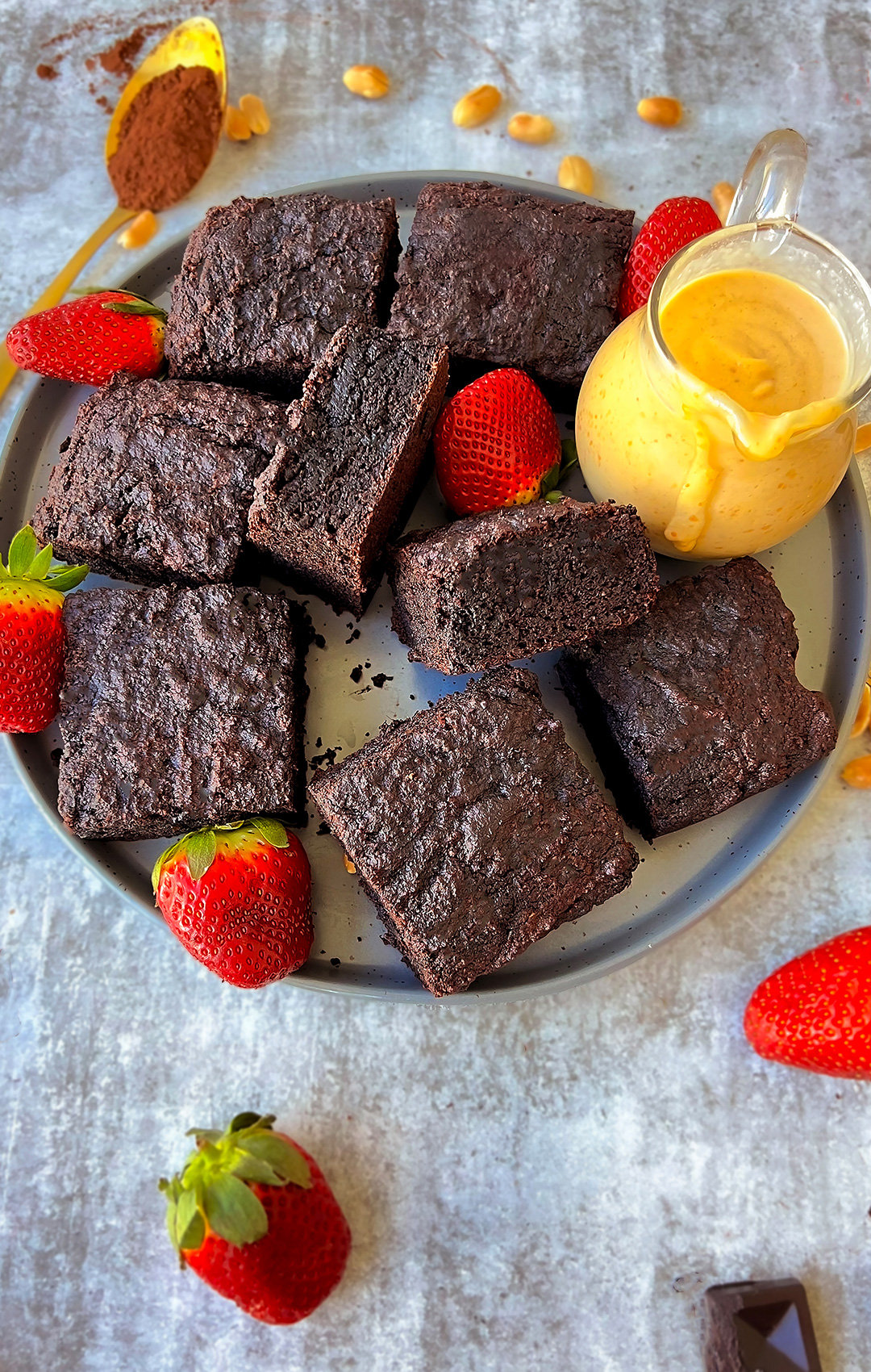 Healthy, gluten-free banana date brownie cake slices on a plate with peanut butter sauce, naturally sweetened and Pale & Gluten-free