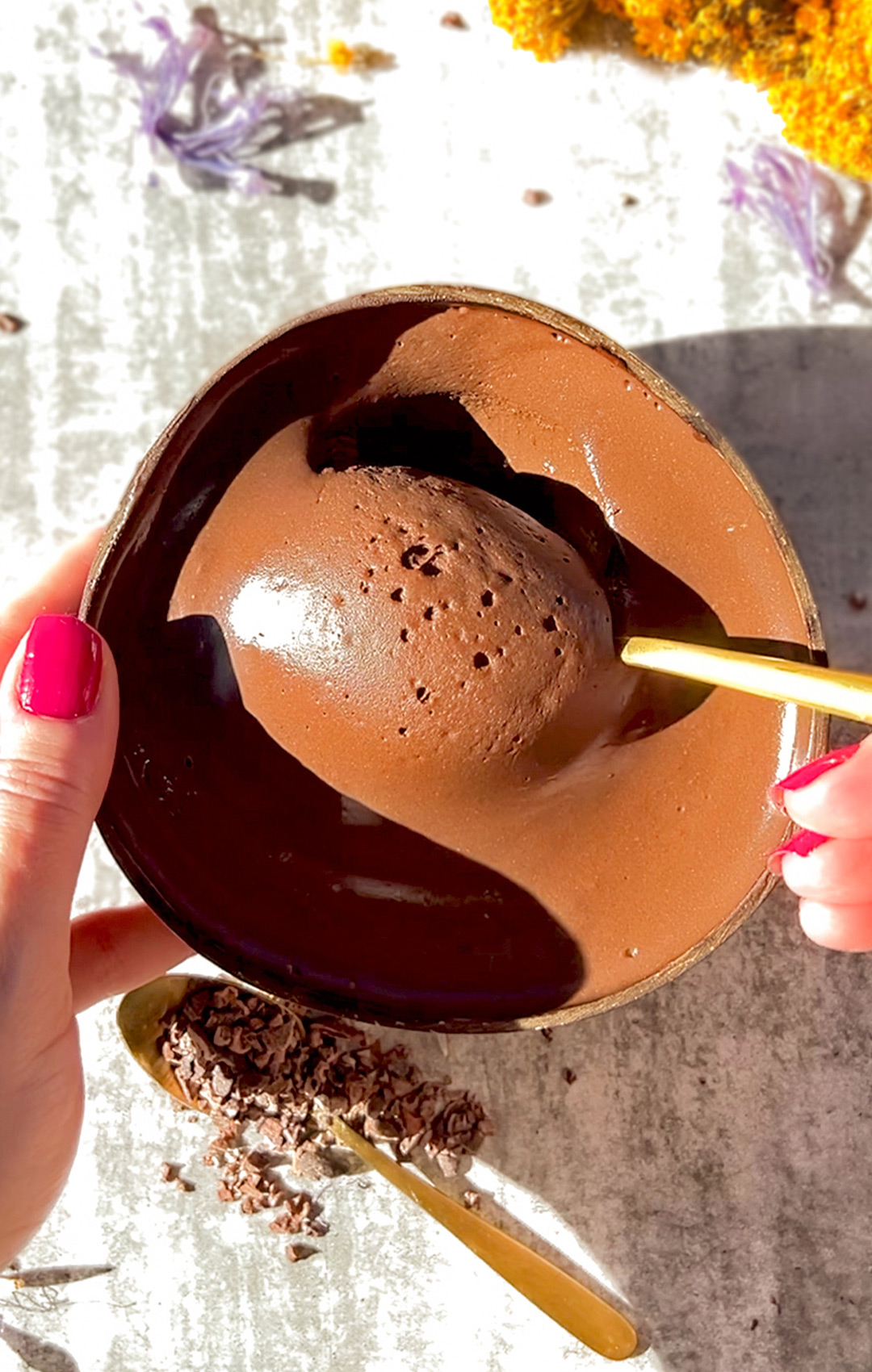 Silky chocolate cottage cheese mousse with a spoon resting on the bowl, showing its rich, decadent texture. A healthier, sugar-free, and keto-friendly dessert option.