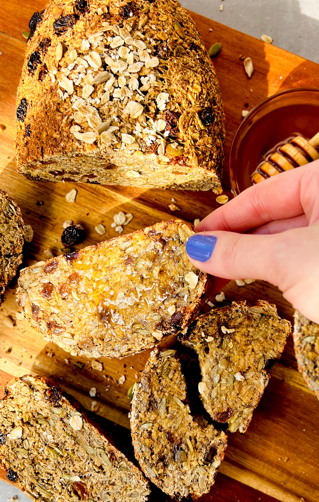 Sliced cottage cheese oat bread served on plate with toppings like Honey and butter- after workout- high-protein, gluten-free
