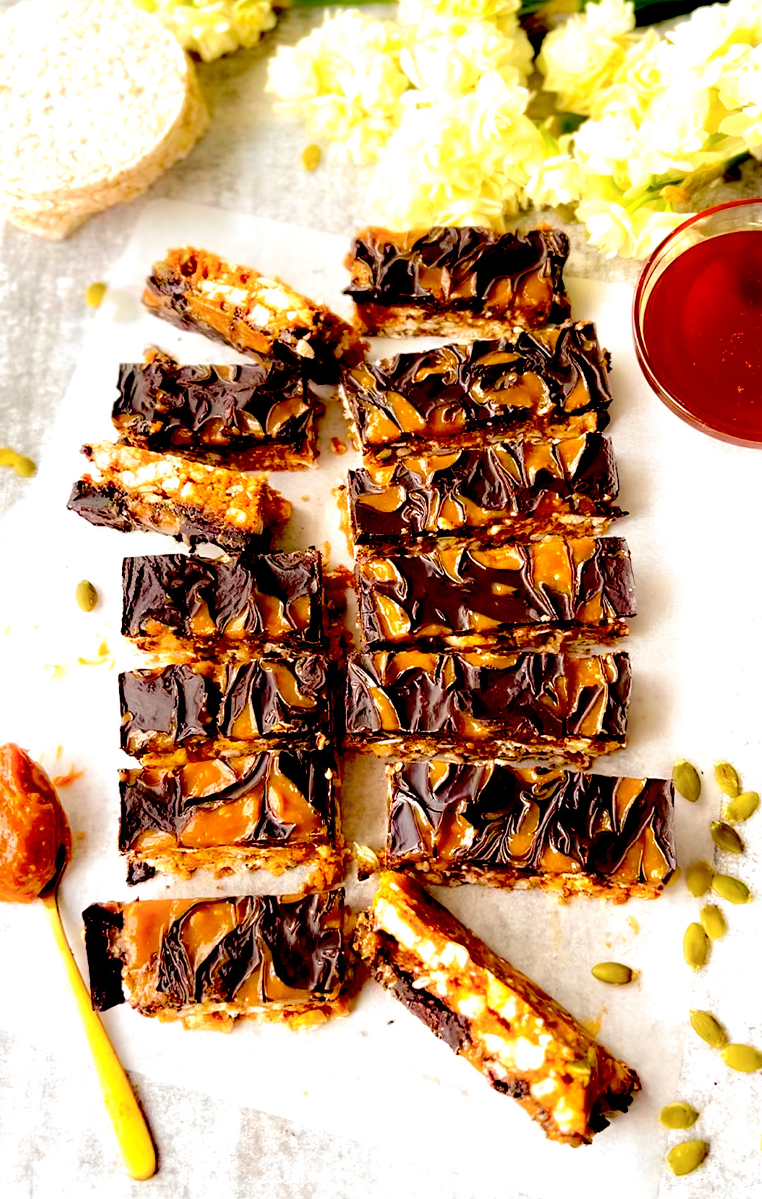 Vegan-friendly Rice Cake Crunch Bars arranged on a cutting board next to coffee—ideal for breakfast or an afternoon treat- gluten-free, Healthy, child friendly