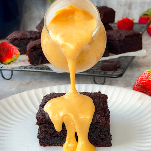 rich and creamy texture of Peanut Butter Dessert Sauce drizzled over fudgy brownie cake (Refined Sugar-Free, dairy free, paleo, keto )