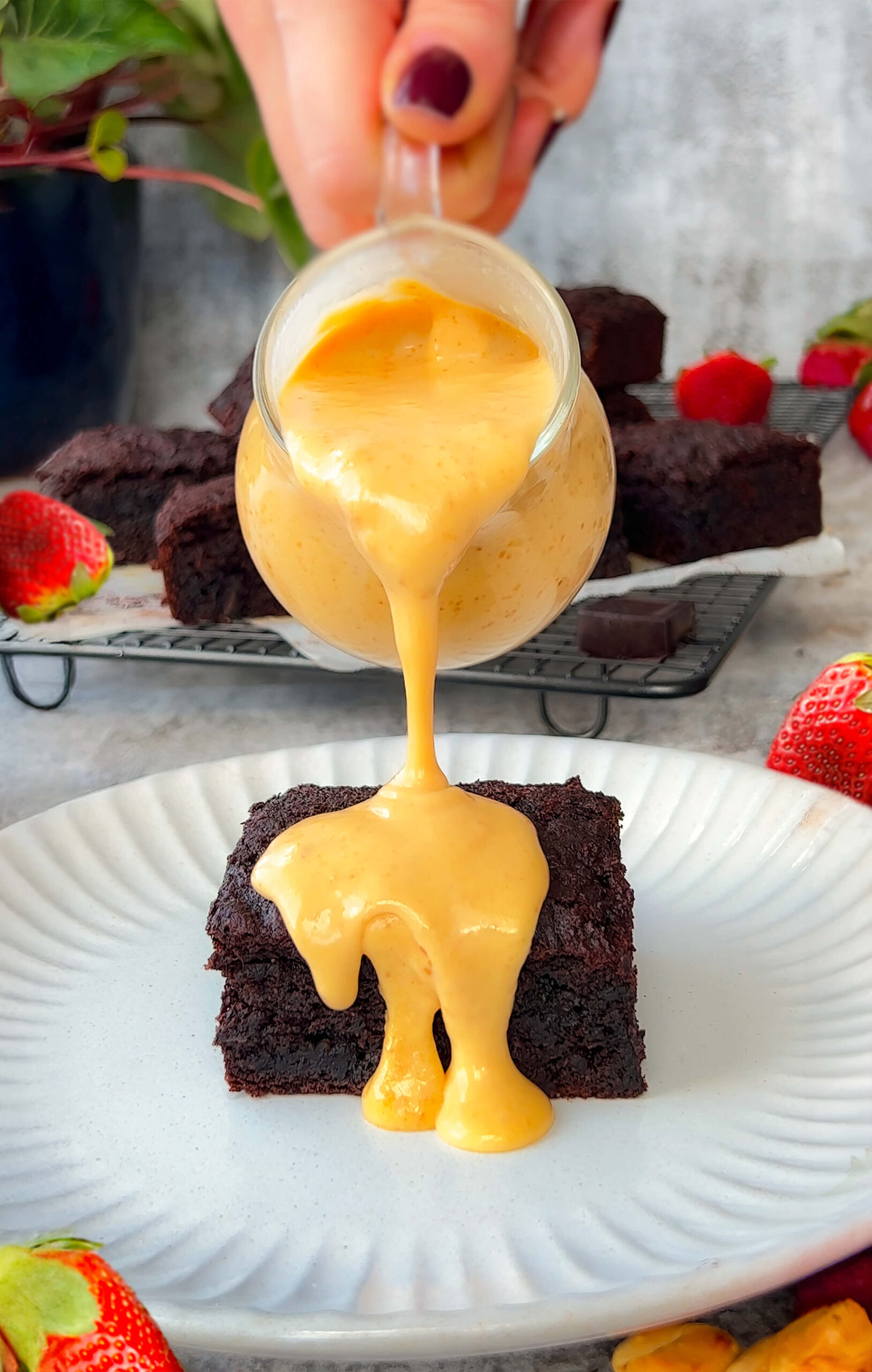 rich and creamy texture of Peanut Butter Dessert Sauce drizzled over fudgy brownie cake (Refined Sugar-Free, dairy free, paleo, keto )
