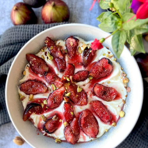 Honey Roasted Figs Yogurt Bowl, a healthy and refined sugar free treat. Juicy figs are gently caramelised with honey, cinnamon, and lemon, then served over creamy yogurt with a touch of zest and crunchy pistachios. Perfect for breakfast, a quick snack, or a light dessert. its, Paleo, Vegan and Keto option.