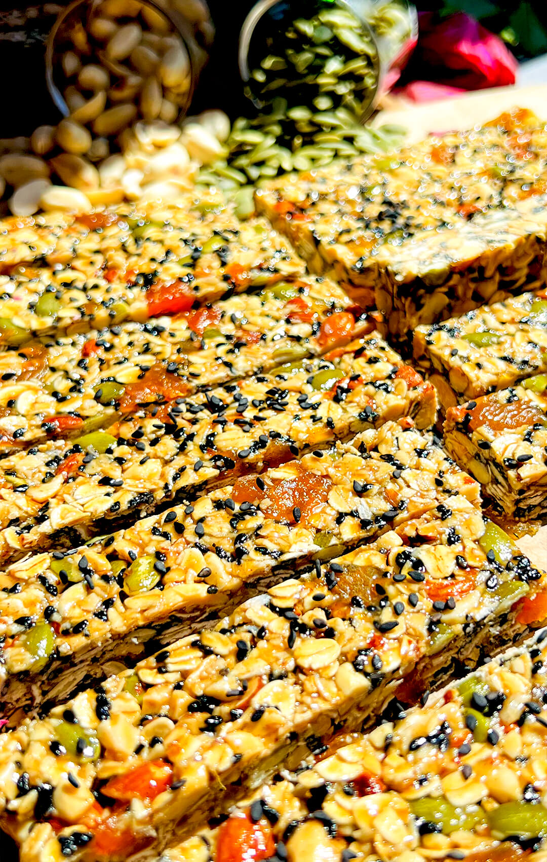 chewy honey and oat granola bars, combination of rich tahini and honey, creating a soft caramel like taste with a delicate hint of rosewater and cardamom, also every bite is filled with little pops of sweet apricot, crunchy pumpkin seeds, nutty almonds and black sesame, gluten free quick and easy homemade snack