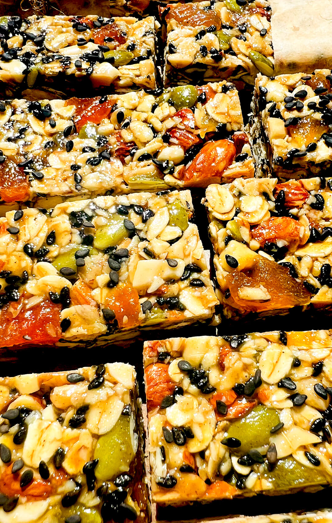 oat granola bars with seeds and dried apricot, healthy gluten free snack bars naturally sweetened with honey and tahini, chewy with a soft caramel like texture, so easy to make , healthy and gluten free