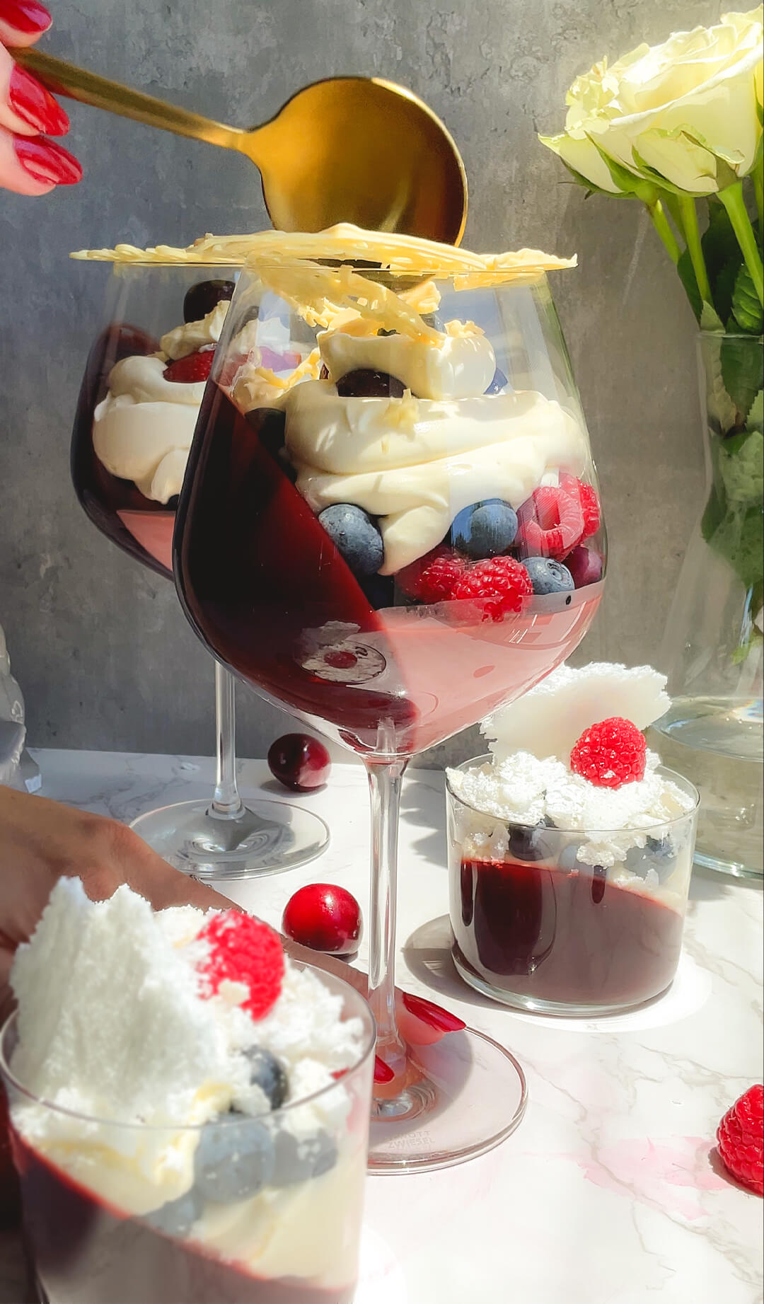 This image captures the signature moment of cracking the delicate white chocolate lace before digging into the sugar free trifle. Underneath are creamy layers, fresh berries, and pomegranate jelly, silky flummery layer. A playful, elegant, and satisfying dessert made without refined sugar and perfect for festive tables. its Low carb, keto, gluten free and sugar free.
