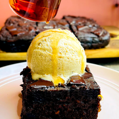 Fudgiest sweet potato chocolate brownie topped with a scoop of homemade refined sugar free vanilla ice cream and syrup drizzle, healthy gluten free, flourless, no sugar added dessert