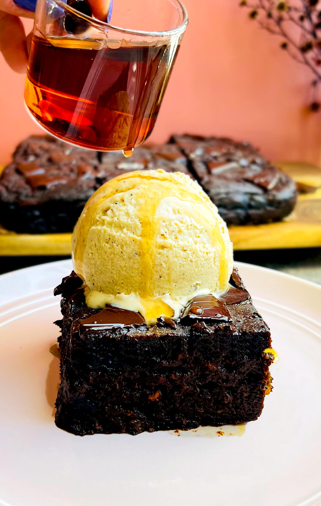 Fudgiest sweet potato chocolate brownie topped with a scoop of homemade refined sugar free vanilla ice cream and syrup drizzle, healthy gluten free, flourless, no sugar added dessert