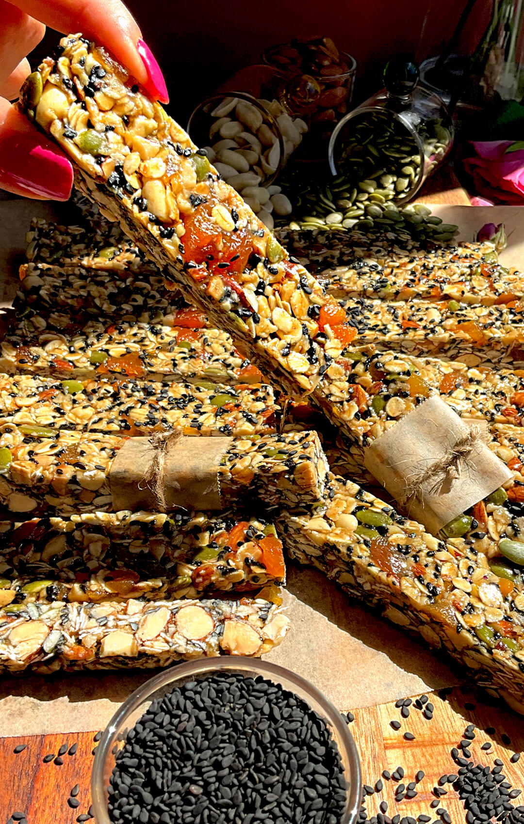 stacked oat and nut granola bars with honey and tahini, chewy healthy gluten free bars naturally sweetened with seeds and dried apricot, soft caramel like taste with a delicate hint of rosewater and cardamom
