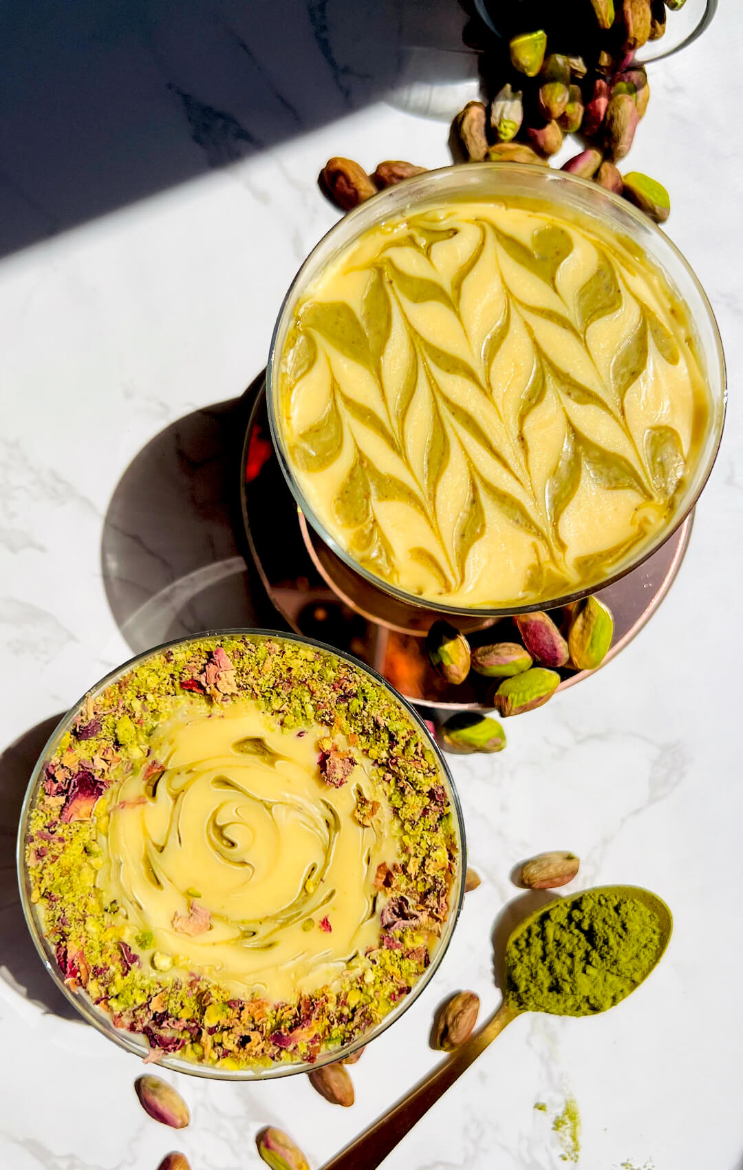 Two glasses of healthy pistachio cottage cheese pudding served as a make-ahead dessert.perfect as a make-ahead dessert. This high protein, gluten-free pudding is quick and easy to prepare with just a blender, simple ingredients, and refrigeration.