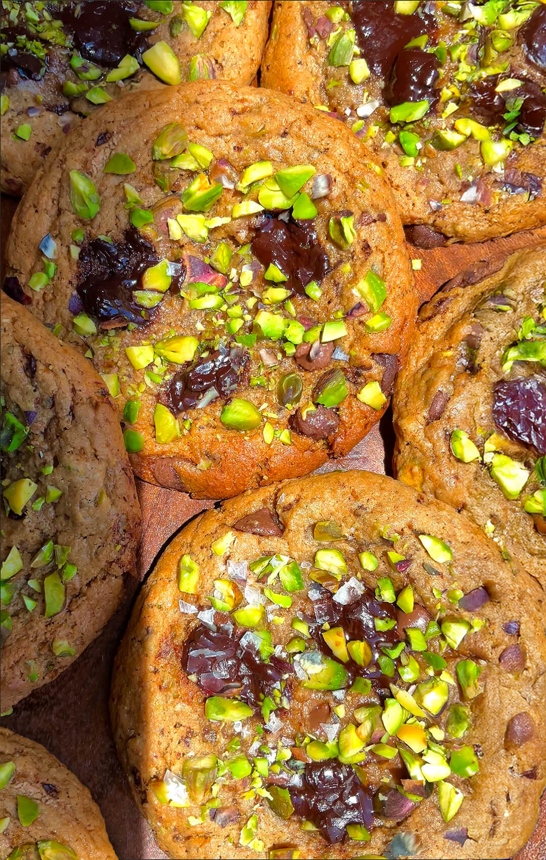 bakery-style pistachio chocolate chunk cookies with Crispy caramelised edges with that irresistible soft, fudgy, melt-in-your-mouth centre, filled with melty dark chocolate puddles, crunchy pistachios, and finished with a little sprinkle of flaky sea salt. Healthy gluten-free and no refined sugar cookies.