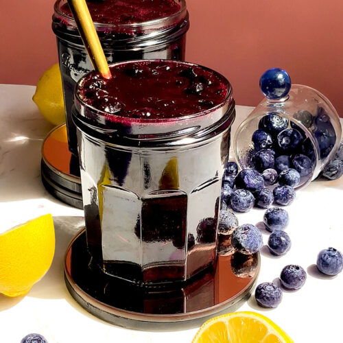 Healthy blueberry sauce in a jar, perfect Thick, glossy and jammy, refined sugar-free topping with blueberries that stay mostly whole. Using for pancakes, yoghurt, desserts, or toast. Paleo, naturally sweetened with honey and monkfruit sweetener