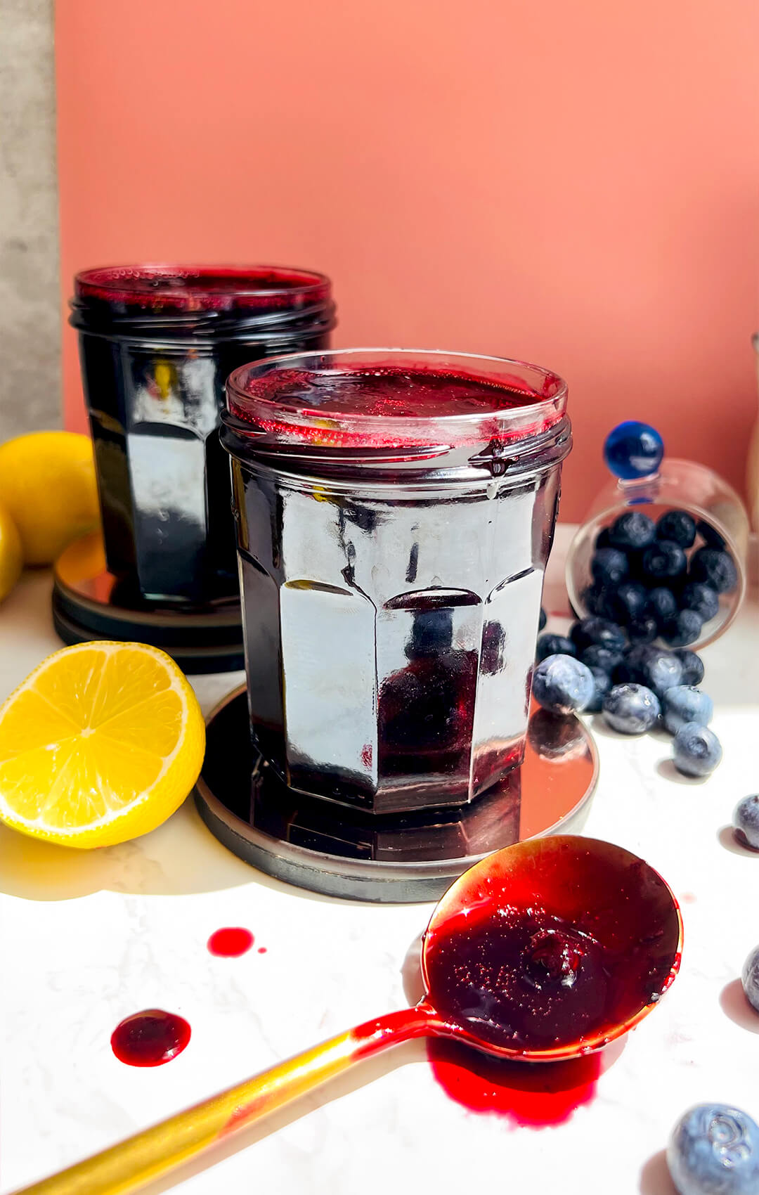 © 2026 Healthy Food by Annie. All rights reserved. Homemade blueberry sauce in a jar with serving spoon, thick glossy refined sugar-free topping for desserts or toast. Paleo, naturally sweetened with honey and monkfruit sweetener