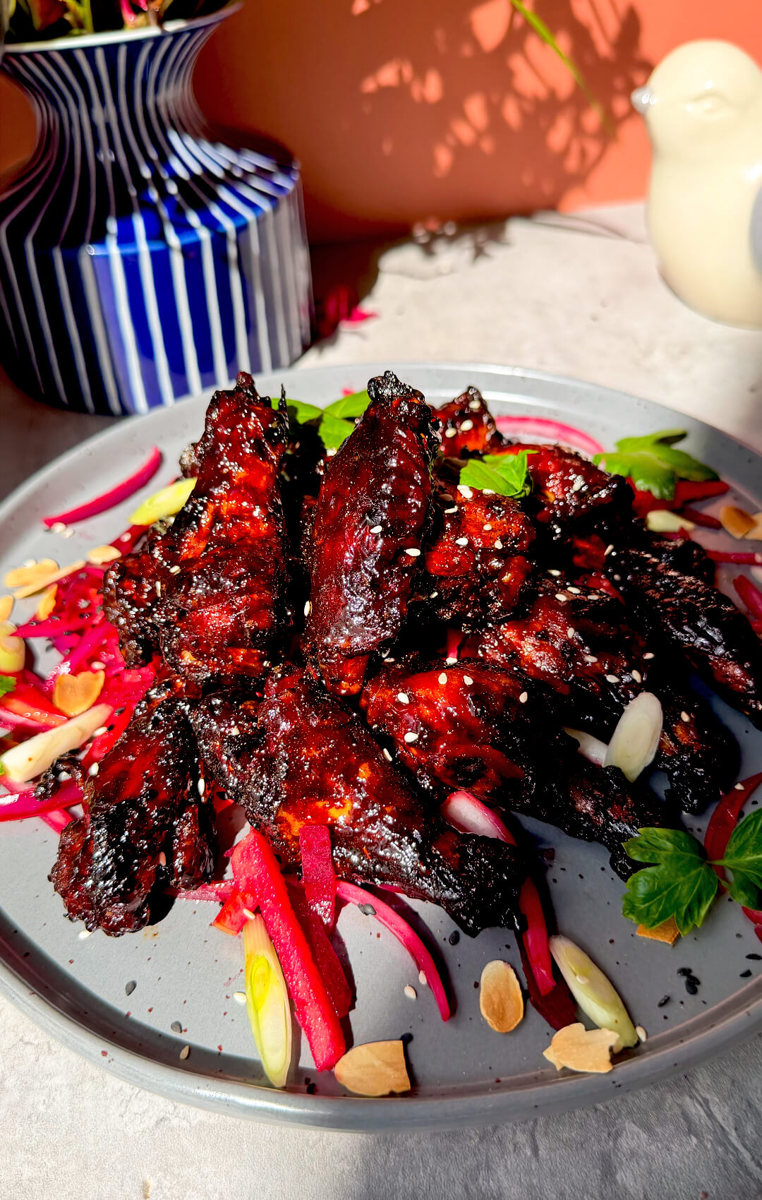 Crispy sticky honey soy air fryer wings served with a bright pink beetroot, apple, cucumber, and red onion salad. These healthy chicken wings are coated in a dark red secret glaze, naturally sweetened with honey, dairy-free, high-protein, smoky, sweet, savoury, glossy, caramelised, and perfect for dinner, Appetizers, Side Dishes, sharing plates, movie nights, or a fun family meal.