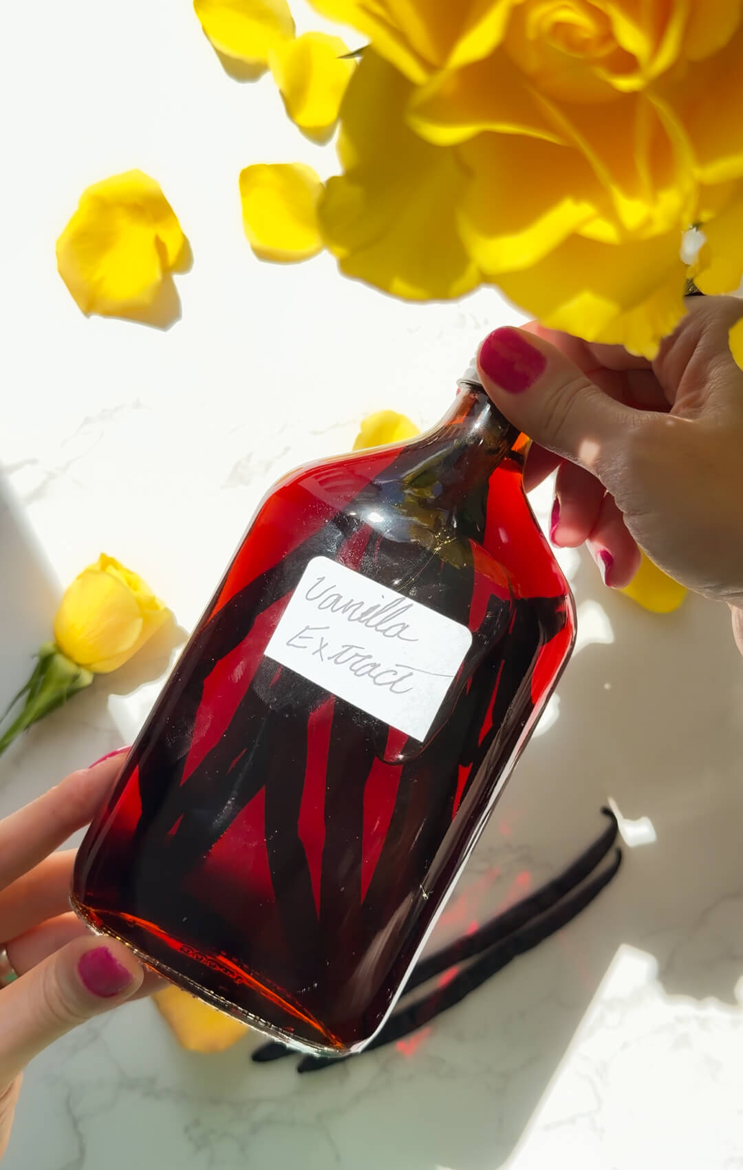 © Healthy Food by Annie. All rights reserved. No reuse, copying, editing, reposting, or redistribution without written permission. Aged homemade vanilla extract in a glass bottle with Madagascar vanilla beans, showing the deep amber colour after infusion. 10 minutes of hands-on preparation with only 2-ingredient